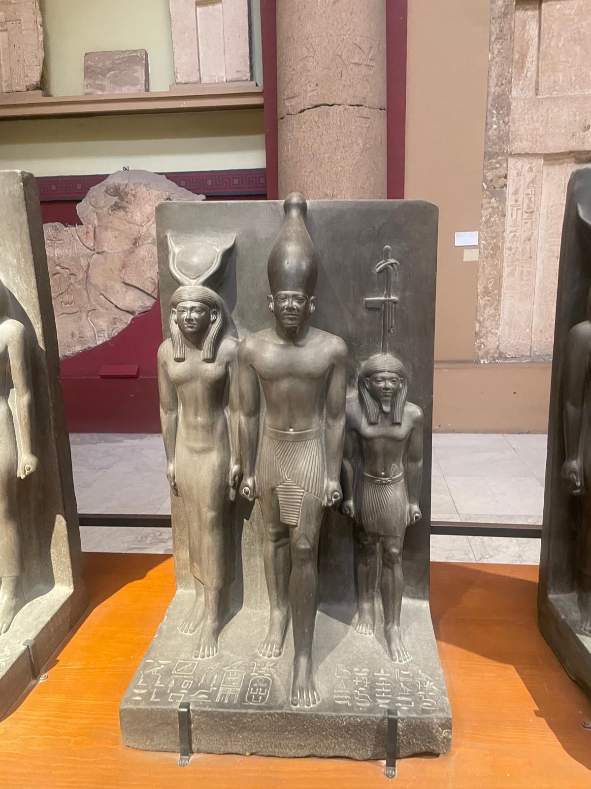 A family carved in stone. Father, mother, and child.