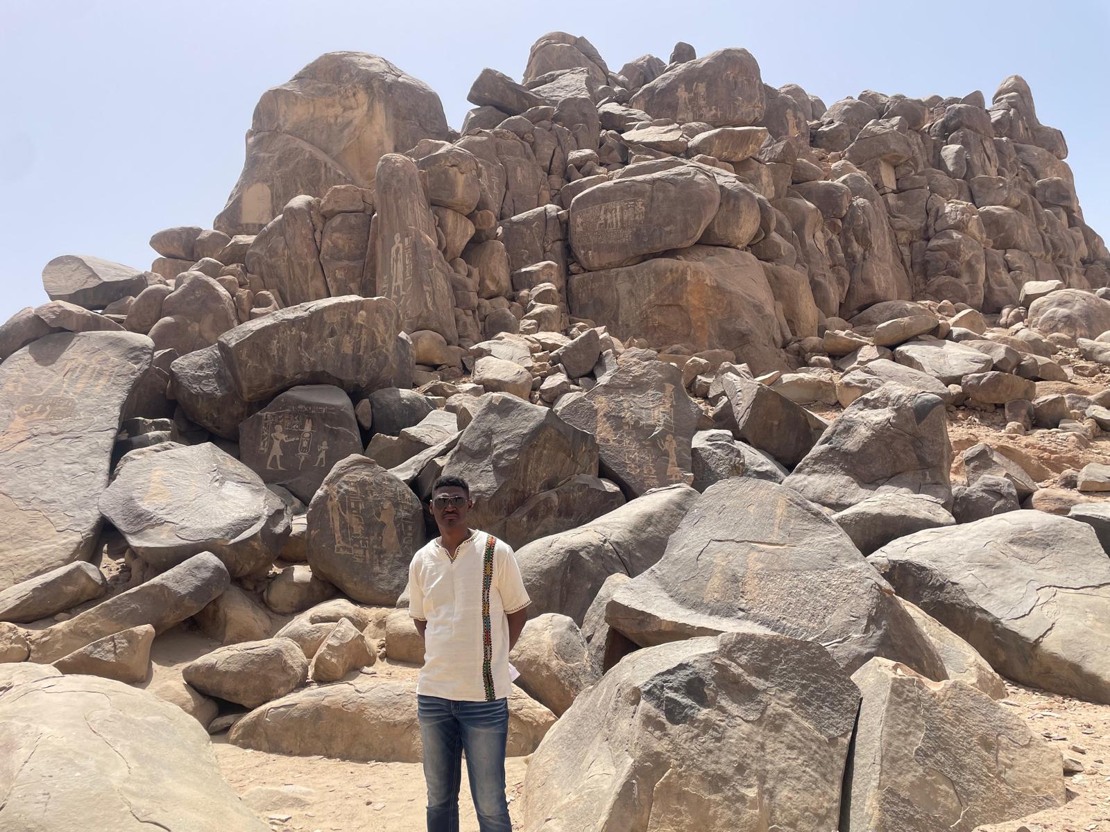 Among the inscribed boulders of the ancestors.