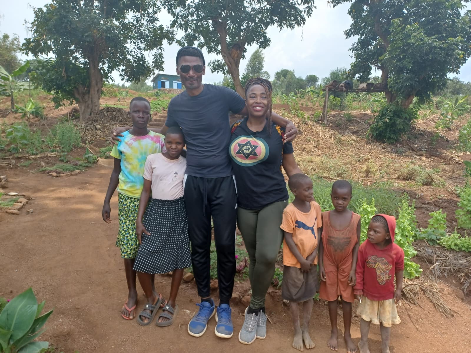 Surrounded by the children of the village.